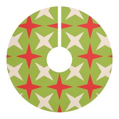 a green and red christmas ornament with white stars