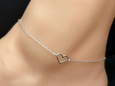 Stylish silver chain anklet   Open Heart Charm centred along chain of anklet  Highest quality guaranteed 925 sterling silver (92.5% pure silver). Specifications:     Color: Silver    Material: 925 Sterling Silver    Length of Anklet: 22 cm + 3 cm extension approximately Dimensions of Heart: 9 mm x 7 mm approx Package Includes: 1 x Sterling silver anklet with complimentary jewellery pouch Elegant Silver Anklets For Valentine's Day, Silver Anklets With Heart Charm For Valentine's Day, Elegant Silver Anklets With Heart Charm, Dainty Heart-shaped Anklet For Gift, Dainty Silver Heart Anklets, Dainty Heart-shaped Anklet As Gift, Silver Heart-shaped Anklets As Gift, Silver Chain Anklet, Anklet Silver