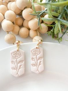 These birth flower earring dangles for a June birthday gift for her are unique and classic. The rose flower earring are perfect custom birth flower gift. If you would like to add a personalized gift box, click the link below:  https://www.etsy.com/listing/1529096992/personalized-small-jewelry-gift-box?click_key=782a028990728cca9fbc0870cf096f5be491cddc%3A1529096992&click_sum=57bef83d&ref=shop_home_active_17&frs=1&sts=1 If you would prefer another flower for this style, please send me a message an Clay Flower Earrings For Gift, Delicate Flower-shaped Clay Earrings For Gifts, Clay Flower Earrings As Gift, Everyday Pink Flower Earrings, Clay Ball, Clay Flower Earrings, June Birthday, Earring Dangle, Flower Earring