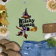 Spooky Halloween fun awaits you with this Witchy Woman Graphic Shirt! This Witchy Woman shirt is perfect for any Halloween activity. From trunk or treat events, to festivals, to just hanging out watching scary movies, this will be your go to shirt this Halloween season! Shop Born To Be Sassy for all of your fun Halloween graphic tees! Funny Halloween Tops With Character Print, Funny Character Print Tops For Halloween, Fun Fall T-shirt With Funny Print, Funny Halloween Print Tops, Halloween Novelty Tops With Letter Print, Fun Halloween Top With Character Print, Fall Novelty T-shirt With Funny Print, Fun Halloween Character Print Top, Casual Graphic Print Top For Costume Party