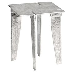 a small metal table with two legs