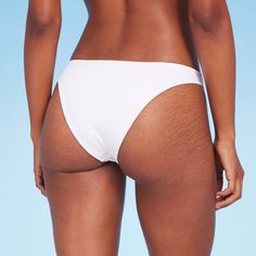 Add a versatile swim separate to your beach-ready closet with this High Leg Extra-Cheeky Bikini Bottom from Shade & Shore™. Made from soft fabric with spandex and full lining for stretchy comfort in and out of the water, this solid-color bikini bottom is designed with a low rise and high leg. The extra-cheeky cut lends you a flattering fit, while the opaque construction offers plenty of coverage for confident wear. Shade & Shore™: Found exclusively at Target. Seamless Solid Swimwear For Vacation, Seamless Nylon Swimwear For Sunbathing, Beachwear Nylon Tankini With Stretch, Seamless Beachwear Bottoms For Beach Season, Seamless Beachwear Bottoms For Vacation, Beachy Seamless Bottoms For Vacation, Stretch Nylon Swimwear For Sunbathing, Seamless Summer Bottoms For Beach, Beach Swimwear With Bra-friendly Nylon