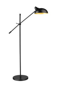 a black floor lamp with a yellow light on the top and an arm that is attached to it