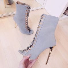 Elevate your style with these Grey Peep Toe Summer Sandal Booties. Featuring lace-up detailing, stiletto heels, and a trendy peep-toe design, these ankle boots are perfect for summer chic looks. Color: Grey Material: Vegan suede Heel Type: Stiletto heel Heel Height: 4.72" / 120 mm approx Product measurements were taken using size 8. Please note that measurements may vary by size. Toe: Peep toe Lace-up design Side zipper closure Handcrafted US sizing. Fits true to size. Party Heels With Front Lace-up Fastening, Gray High Heel Boots For Party, Chic Fitted Gray Heels, Gray High Heel Party Boots, Gray Heels For Spring Party, Gray Party Heels For Spring, Chic Ankle-high Heels With Laces, Gray Lace-up Boots For Spring, Chic Lace-up Heels With Laces