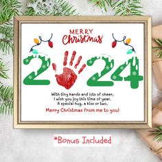 a christmas card with handprints on it