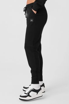 Meet the sweats you’ve seen all over your feed. They’re done in a plush, incredibly soft, wide-ribbed fabric that feels as good as it looks. The jogger-style silhouette is luxuriously cozy with a high-rise waistband and ankle cuffs. Make it a matching set with the Muse Hoodie. Sporty Solid Ribbed Pants, Casual Ribbed Bottoms For Lounging, Casual Ribbed Winter Bottoms, Comfy Ribbed Cotton Bottoms, Casual Ribbed Bottoms For Winter, Casual Black Alo Yoga Bottoms, Cozy Streetwear Bottoms With Ribbed Waistband, Cozy Bottoms With Ribbed Waistband For Streetwear, Athleisure Ribbed Bottoms