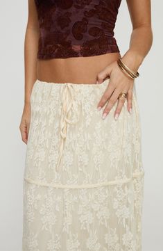 Full of romantic charm, this sweeping tiered maxi skirt is crafted from delicate lace with a lettuce hem. 38 1/2" length (size 4) Ties at waist Lined 100% polyester Hand wash, line dry Imported Maxi Lace Skirt, Knit Maxi Skirt, Tiered Maxi Skirt, Lettuce Hem, Fleece Dress, Floral Maxi Skirt, Outerwear Outfit, Lace Maxi, Curve Dresses