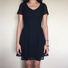 🎉HP 11/22🎉 Cotton On Little Black Chiffon Dress Black. Chiffon dress with v-neckline, short sleeves and a flowy skirt. 100% polyester. New with tags. Cotton On Dresses Casual Chiffon V-neck Mini Dress, Chic Fitted Chiffon Dress With Short Sleeves, Short Sleeve Chiffon Dress For Day Out, Black Chiffon Mini Dress For Summer, Casual Short Sleeve Chiffon Mini Dress, Casual Chiffon Mini Dress With Short Sleeves, Casual V-neck Chiffon Mini Dress, Chiffon V-neck Dress For Work, Black Short Sleeve Chiffon Dress For Spring