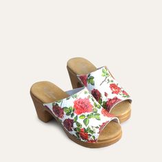 A romantic take on our open-toe mule clog. The textured white leather upper is embossed with a gorgeous floral motif. Handcrafted in Italy from premium leather, the Frida clog features a cushioned sole that flexes as you walk for all-day comfort. Pair with a floaty dress or wide-leg jeans for a dreamy look. Flexible sole with wood-like effect Heel 7,5 cm / 2.95 Inches Handmade in Italy White High Heel Clogs For Spring, White Open Toe Clogs With Leather Sole, White Open Toe Clogs With Cushioned Footbed, White Mules With Wooden Heel For Spring, White Wooden Heel Mules For Spring, White Cushioned Open Heel Mules, White Open Heel Mules With Cushioned Footbed, White Mules With Cushioned Footbed And Open Heel, White Clogs With Wooden Heel For Summer