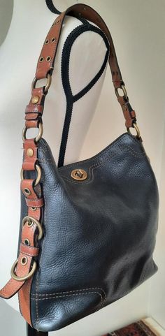 Vintage 1990s Coach Navy Leather Shoulder Bag. Crafted with dark navy pebble leather. Featuring a spacious organized interior with one zip compartment and two open compartments for access to essentials, This tote style bag has a comfortable, wide shoulder strap and is embellished with polished brass grommets. This roomy square shape shoulder bag secures with the Coach Signature turnlock closure. Not too big, not too small, this perfect go-anywhere shoulder bag has space for all of your day-to-da Brown Leather Strap, Navy Leather, Square Shape, Polished Brass, Dark Navy, Leather Handle, Pebbled Leather, Coach Bags, Leather Tote