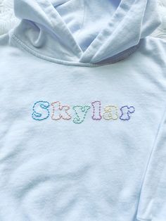 a white hoodie with the word skylar embroidered on it