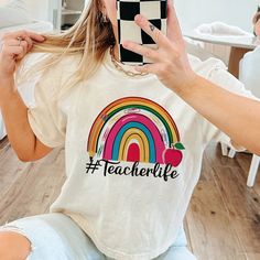 Teacher Life  Shirt, Inspirational Teacher Shirts,Teach love, Back To School, First Grade Teacher Shirts, Teacher Appreciation Tee Shirt  : 100% Cotton (fiber content may vary for different colors) .: Medium fabric (5.3 oz/yd² (180 g/m .: Classic fit .: Runs true to size HOW TO ORDER Pick you favorite design. Review the size & color charts above FIRST and then select shirt size and color from the dropdown menu. Indicate the birthday year in the personalization box. Please note size measurements Rainbow Letter Print Cotton Tops, Cute Rainbow Print Cotton T-shirt, Fun Short Sleeve Tops For Teaching, Casual Tops With Text Print For Teaching, White Cotton T-shirt For Teaching, Casual Relaxed Fit Tops For Teaching, White Cotton T-shirt, Casual Short Sleeve Shirt For Teaching, White Relaxed Fit Top For Teaching