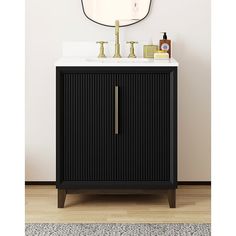 a bathroom vanity with a mirror above it and a rug on the floor next to it