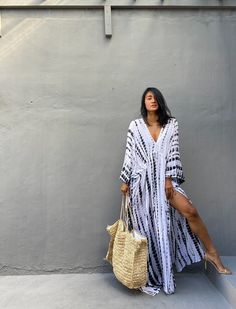 "\"Uluwatu Kaftan dress\" Soft, Smooth, Lightweight Rayon voile Fabric. Perfect for Elegant Day and Nightwear or worn as a cover-up for that beach or poolside statement of glamour. And for Muslim women Color - Hand Tie Dyed White & Black Measurements in CM and Inches. Size American measurement Medium to Large. It fits to all the body size between M to2XL Size - One size fits all American size From S to 2XL Total wide /240cm/94inch(round) Chest & him /180cm/70inch(round) The length /150cm Bohemian V-neck Kaftan For Vacation, White V-neck Bohemian Kimono, Bohemian Maxi Dress For Summer Beach Cover-up, Boho Print Maxi Length Cover-up For Festivals, Flowy Boho Sundress For Beach Cover-up, Hippie V-neck Free Size Maxi Dress, White V-neck Kimono For Festival, Casual Maxi-length Kaftan For Vacation, White V-neck Summer Kimono