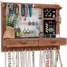 Jewelry wall organizer is made of rustic wood with carbonized finish, feature a rustic and stylish look that complements a variety of decors; after dressing up, turn to this jewelry organizer—all your jewels are organized in front of you, no tangled necklaces, no missing earrings—easily pick the right accessories to make you shine for the day ahead of you. 21 hook areas for necklaces and bracelets, white mesh for earrings, 1 ring area, 1 stud area, a shelf for perfumes, and 1 removable bracelet Picture Frame Jewelry Holder, Small Boutique Ideas, Jewelry Wall Organizer, Mesh Earrings, Perfume Holder, Wall Mount Jewelry Organizer, Jewelry Organizer Wall, Jewelry Wall, Hanging Jewelry Organizer