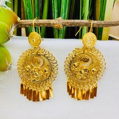 Beautiful and stunning handmade Mexican Filigree Earrings. Each piece is meticulously created out of copper wire and spun into a beautiful design. To give it the final touch artisans dipped into gold plate for it's gold color. This accessory is an important part of the traditional Tehuana outfit from Oaxaca, Mexico. Look elegant while wearing Mexico's culture with this one of a kind earrings! Approximate length: 3-3.5 in Need more than one? Ask us about our combined flat rate shipments for multi Mexican Jewelry Gold Earrings, Gold Mexican Jewelry, Mexican Jewelry Gold Mexico, Mexican Hoop Earrings, Mexican Filigree Earrings, Mexican Earrings, Mexican Blouse, Classic Girl, Mexico Culture