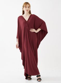 "🚚..ALL ORDERS ARE SHIPPED VIA DHL EXPRESS MAIL This soft red caftan dress is a great timeless wardrobe essential that you should not miss. Great for all shapes and sizes. * Pullover style * Deep v neck * Ruched detail at front with weaving rope strips * Batwing sleeves * Relaxed fit * For a slouchy silhouette * Unlined Measurements approximately: Sleeve Length (from side of neckline): 25\" (63.5 cm) Sleeve cuff: 18\" (46 cm)-round Bust: 66\" (168 cm)-all around. Hips: 60\" (152 cm)-all around. Elegant Maxi Length Kaftan For Loungewear, Red Flowy Dress With Kimono Sleeves, Red Long Sleeve Maxi Dress For Beach Cover-up, Flowy Red V-neck Kaftan, Red Bohemian Loungewear Dress, Flowy Red Maxi Kaftan, Red Kimono Sleeve Dress For Beach Cover-up, Red Maxi Length Kaftan For Evening, Red Maxi Length Evening Kaftan