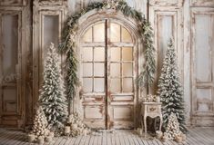 an image of a christmas scene with snow and trees in front of the door that is open