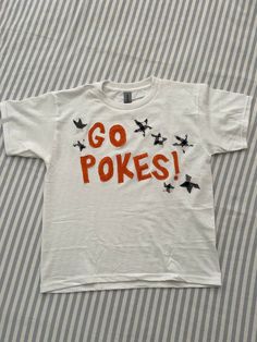 a t - shirt that says go pokes on it