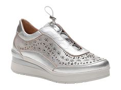 Stonefly Cream 15 Laminated Lth - Women's Shoes : Metal Silver : Turn heads wearing the Stonefly Cream 15 Laminated Lth sneakers showcasing a perforated and stud accented Italian leather upper, slip-on construction with elastic toggle closure, and low platform wedge heel. Blu Soft technology is a unique gel pad created to relieve shock absorption. Leather lining and insole. EVA outsole. Imported. Weight of footwear is based on a single item, not a pair. Silver Sneakers With Removable Insole And Round Toe, Silver Sneakers With Removable Insole, Silver Slip-on Sneakers With Round Toe, Wedge Sneakers Style, Adventure Hat, Platform Wedge Heels, Rhinestone Embellishments, Platform Wedge, Platform Wedges