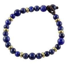 Blue lapis lazuli stones grace the wrist in this beaded bracelet from Thailand. With a passion for fashion and jewelry Tiraphan Hasub crafts this adjustable bracelet adding petite beads of brass with a matte finish. This wonderful accessory for women closes with a lapis bead button clasp. Paw Print Jewelry, Lapis Lazuli Bracelet, Blue Beaded Bracelets, Ribbon Jewelry, Lapis Lazuli Beads, Blue Lapis Lazuli, Printed Jewelry, Lapis Lazuli Stone, Popular Jewelry