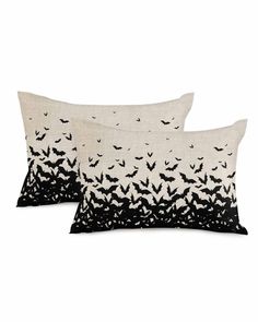 two black and white pillows with bats on them