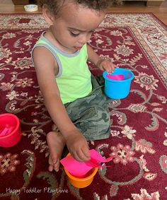 a young child playing with toys on the floor