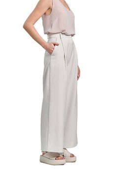 These Pleated Wide Leg Pants are perfect for the modern woman. Made from a blend of cotton, satin, and elastane, they offer a comfortable fit and a high waistline. The wide leg trousers add a touch of elegance to any outfit, whether it's for a casual day out or a formal work event. Pair them with your favorite top and accessories to create a chic and sophisticated look. High rise Slanted side pockets Full length Wide legs Hook-&-bar / zip fly Belt loops Material: 70% cotton 26% satin 4% elastane Elegant Cotton Culottes, Elegant High-waisted Cotton Culottes, Formal Cotton Wide-leg Bottoms, Elegant High-waisted Culottes With Relaxed Fit, Elegant High-waisted Relaxed Fit Culottes, Formal Cotton Wide-leg Pants, Elegant High-waisted Cotton Pants, High Waist Cotton Bottoms For Formal Occasions, Elegant High Waist Wide Leg Cotton Pants