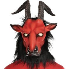 Release the beast from the burning hellfire in this devilish mask. The red latex mask features a goat head with skewed brown horns blank white eyes pointy red ears and a long black beard. Hellfire Beast Mask product details:  Latex mask  Mesh eyes Attached faux fur Secures by elastic band   One size fits most teens and adults Beast Mask, Goat Mask, Black Beard, Goat Head, Red Mask, Black Beards, Halloween Costume Shop, A Goat, Halloween Store