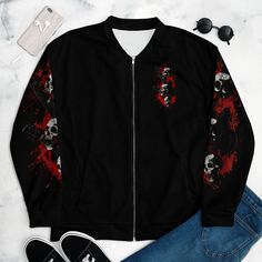 a black jacket with red paint splattered on the sleeves, and two pairs of shoes