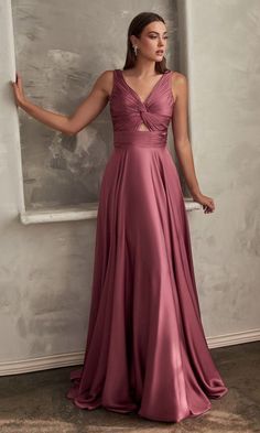 Here's a beautiful long a-line prom dress that is as stylish as it is affordable. Budget-priced under $150, this v-neck long formal dress is an upscale style for prom, galas, and other black tie events. In misses and some plus sizes, this long evening gown has a ruched v-neck bodice with front knot detail and a triangle-shaped cut out that adds a sexy vibe. A free-flowing long a-line skirt completes the look of this long prom dress that allows you to look polished without emptying your bank acco Draping Project, Satin Long Gown, Cinderella Divine, Twisted Dress, Female Clothes, Keyhole Dress, Mauve Dress, Long Bridesmaid Dress, Trendy Dress