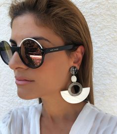 A unique pair of women earrings in hoop shape in black and white colors that open and closes with clip. Find Them only at Christina Christi Store. 👉 My Earrings Collection: https://etsy.me/2UiXmKR 👉 Express Shipping: https://etsy.me/3ikUnOM DIMENSIONS - Round Earrings Have Length 9,5 cm (3.7''). MATERIALS - Metal Parts. - Plexiglass Parts. - Marble Stone. Social Media *Facebook Page: @ChristinaChristiJewels *Instagram Profile: @christina_christi_jewels ##NEW DHL EXPRESS SHIPPING ADDED## EU EST Trendy White Metal Earrings, Trendy Single White Earring, Trendy White Single Earring, Modern White Clip-on Jewelry, Trendy White Metal Clip-on Earrings, Modern White Pierced Earrings, Trendy Nickel-free White Earrings, Trendy White Drop Clip-on Earrings, Trendy White Nickel-free Earrings