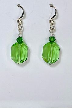 Swarovski peridot green crystal cosmic drop earrings on sterling silver french hooks These beautiful, handmade earrings have incredible sparkle and are suitable for all occasions and perfect gift for women. Great gift to show love and friendship. Arrives in gift box ready for giving. Valentine's Day, Mother's Day, Birthday, any occasion for small gift. Arrives in gift box ready for gifting. Green Faceted Sterling Silver Earrings, Green Sterling Silver Crystal Earrings, Nickel-free Green Crystal Earrings In Sterling Silver, Nickel-free Green Sterling Silver Crystal Earrings, Green Sterling Silver Crystal Drop Earrings, Green Sterling Silver Drop Earrings, Handmade Green Crystal Sterling Silver Earrings, Green Crystal Dangle Earrings, Green Crystal Drop Earrings