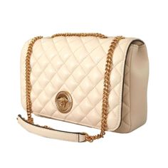 Stay in style with the Versace La Medusa Quilted Beige Leather Crossbodybag. This luxurious Versace shoulder bag features a polished gold chain link shoulder strap and a iconic gold Medusa head logo on the front. The quilted leather shoulder bag opens to a roomy black fabric interior with a slip pocket. This bag is perfect for sunday brunch, date night, or any social gathering!      Model: DBFI164S    Beige Quilted Lambskin Leather  Gold-tone hardware  Snap Closure  One interior slip pocket  Bla Luxury Rectangular Shoulder Bag With Gold-tone Logo Plaque, Elegant Travel Shoulder Bag With Gold-tone Logo Plaque, Luxury Shoulder Bag With Gold Chain, Luxury Shoulder Bag With Metal Logo, Classic Gold Flap Bag With Chain Strap, Classic Formal Shoulder Bag With Gold Chain, Luxury Formal Bags With Gold Chain, Gold Bags With Gold Chain In Classic Style, Classic Leather Bag With Gold Chain