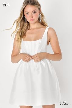 You'll always skip the line when you go out for the night in the Lulus Bubbly Love White Taffeta Corset Mini Dress! Structured taffeta, with a subtle sheen, provides perfectly flattering coverage as it shapes tank-style straps and a bustier-inspired bodice with supportive boning at the front. Skirt has a bubble-like, A-line silhouette and finishes at a flirty mini hem. Hidden zipper/clasp at back. Fit: This garment runs small - please size up. Length: Mid-thigh. Size medium measures 32.5" from s Satin A-line Mini Dress With Ruched Bodice, Flirty Satin Dress With Boned Bodice, Elegant Taffeta Corset Dress With Sweetheart Neckline, Elegant Taffeta Corset Dress For Prom, Flirty Satin Wedding Dress, Fitted Taffeta Mini Dress For Wedding, Elegant Taffeta Mini Dress For Prom, Taffeta Corset Dress With Sweetheart Neckline, Fitted A-line Satin Corset Dress