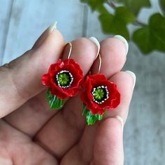 ♥ Handmade with love especiale for you ♥ Unique and one-of-a-kind, each one is different ♥ realistically natural looking Made in Ukraine❤️ Elegant simplicity❤️ Exclusive handmade flower jewellery set with saturated red poppies❤️  *Size - the ring has an adjustable band. * diameter of the poppy is about 1.5 cm (0.59 inches) * can be matte (without lacquer) or glossy (lacquered) * Please choose the best earring clasp type *LOOK FOR SIMILAR ITEMS?  Please follow this link: www.etsy.com/shop/OrxideykaStudio?ref=l2-shop-header-avatar&search_query=poppies *Some details -if you'd like to get jewellery in another colour, we'll be a pleasure to create it for you. Please consider that real colours may slightly differ from one monitor to another, as it depends on specific monitor settings. -these jew Hypoallergenic Flower-shaped Polymer Clay Jewelry, Handmade Flower Drop Earrings As Gift, Handmade Flower Dangle Earrings In Polymer Clay, Handmade Flower Dangle Jewelry In Polymer Clay, Flower Shaped Polymer Clay Earrings For Gift, Red Hand Painted Earrings For Gift, Hand-painted Red Jewelry For Valentine's Day, Hand Painted Red Jewelry For Valentine's Day, Dangle Flower Earrings In Polymer Clay