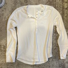 Xl White Long Sleeve Shirt, Half Snap Button On Front, Never Worn, Tags Still On! Overalls With Long Sleeve Shirt, White Long Sleeve Shirt Outfit, Layered Long Sleeve T Shirt, Loose Long Sleeve Shirt, Long Sleeve Shirt Outfits, Crochet Long Sleeve Tops, Layered Long Sleeve, Button Up Long Sleeve, White Long Sleeve Shirt