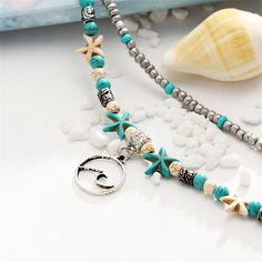 Whether you're walking the shore or just looking for sea-inspired shine, this layered anklet boasts starfish charms and reconstituted turquoise beads to bring beachy vibes to your everyday strides. 0.75'' W x 9.44'' L with 2.36'' extender Lobster claw clasp Silvertone copper / reconstituted turquoise Wave Pendant, Yoga Beach, Foot Chain, Beach Wave, Beachy Vibes, Sea Inspired, Chain Bracelets, Copper Turquoise, Engagement Jewelry