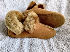 The slippers are made of natural sheep leather, the interior is insulated with soft sheep fur. The bottom of the slippers is finished with durable suede leather, which makes the slippers soft and flexible when walking. The slippers are warm and at the same time very light. When wearing it, you feel as if your feet were wrapped in warm and delicate down. The cut of the slippers is suitable for narrow and medium-width feet. The slippers fit perfectly on the feet. The slippers can be used on any fl Winter Leather Moccasins With Rubber Sole, Comfortable Suede Slippers With Flat Heel, Comfortable Slippers With Suede Lining, Comfortable Suede Slippers With Suede Lining, Brown Indoor Slippers For Winter, Indoor Slippers With Faux Fur Lining, Comfortable Winter Slippers With Leather Footbed, Winter Soft Sole Slip-on Slippers, Comfortable Suede Slippers With Leather Footbed