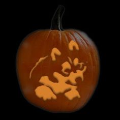 a carved pumpkin on a black background