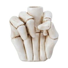 a white ceramic sculpture of hands holding something in it's palm, on a white background