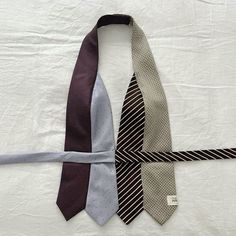 three ties laid out on top of each other