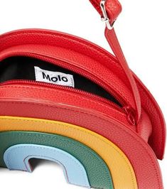 Molo's vibrant vision will incite an imaginative styling streak in tiny trendsetters. Made of grained faux leather, this playful fabric-lined bag is shaped like a colorful rainbow with an adjustable shoulder strap..Closure: zipped top.Internal details: fabric lining.Made in Italy.Material: leather.Adjustable shoulder strap, Leather shoulder strap.Height 14cm-5.5'.Width 23cm-9'.Depth 7cm-3'.Min. length shoulder strap 60cm-23.5'.Max. length shoulder strap 117cm-46' Playful Multicolor Crossbody Bag, Modern Multicolor Bag With Zipper Closure, Modern Multicolor Bags With Zipper Closure, Multicolor Shoulder Bag With Zipper For School, Multicolor Zipper Closure Shoulder Bag For School, Fun Multicolor Crossbody Shoulder Bag, Playful Multicolor Satchel Shoulder Bag, Trendy Rainbow Bags For Everyday Use, Playful Multicolor Shoulder Bag With Removable Pouch