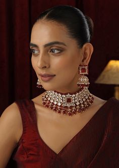 Make a striking statement with this Red Polki Choker set, featuring radiant red stones set in traditional Polki design and finished with a luxurious rose gold touch. The elegant choker design offers a contemporary twist on classic beauty, with the rose gold accents enhancing the deep red hues. Ideal for weddings, festive occasions, or any special event, this set brings together timeless sophistication and modern flair. Polki Choker Set, Choker Design, Hand Jewelry Rings, Gold Touch, Polki Choker, Chain Braid, Red Choker, Elegant Choker, Choker Designs