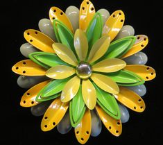 Welcome Spring with this cheery yellow and green four tiered Flower Power Brooch. Enameled in a pale fern, bright yellow, kelly green and pale yellow with a shiny gold tone glossy center. Measures 3" in diameter, mint condition. Very coooooooooooooool! Yellow Flower-shaped Retro Jewelry, Retro Yellow Flower-shaped Jewelry, Retro Yellow Flower Jewelry, Green Spring Brooches As Gifts, Spring Green Brooch Gift, Green Spring Brooches Perfect As A Gift, Green Spring Gift Brooches, Vintage Yellow Flower Brooch, Welcome Spring