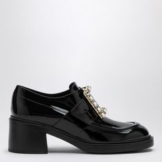 Looking for a shoe that's both chic and versatile? This patent leather loafer is your go-to for adding a touch of elegance to any outfit, whether you're headed to the office or a casual brunch. It's crafted in Italy, blending style with comfort effortlessly. Round toe design Medium heel for added height Front strap with elastic insert and crystal buckle Durable rubber sole Made in Italy 100% leather composition | Roger Vivier Women's Viv Rangers Patent Leather Loafer in Black | Size IT 39 | RVW5 Black Patent Leather Loafers, Roger Vivier Shoes, Patent Loafers, Patent Leather Loafers, Roger Vivier, Leather Cap, Boot Pumps, Sneaker Heels, Handbag Shopping