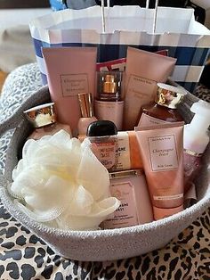 a basket filled with lots of different types of cosmetics and personal care products in it