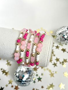 Pink Gold and White Beaded Bracelet, Hot Pink Jewel Bracelet with Flower Bead, Beaded Bracelets Sets, Christmas Stocking Stuffer, Teen Girl Gift, Butterfly, Seed Bead Bracelet, Kids Jewelry, Little Girls Bracelet, Preteen Accessories Absolutely gorgeous pink, gold and white bracelet! Super cute addition to any bracelet stack or even on its own. Pictures do not do this bracelet justice. This bracelet matches our pink mama + mini bracelet.  D E T A I L S - made to order on a durable stretch cord - Hot Pink Gifts, White Bead Bracelet, Jewel Bracelet, Bracelets Sets, Pink Pearl Bracelet, White Beads Bracelet, Mini Bracelet, Rosa Gold, Pink Jewels