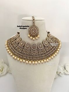 Antique Polki Necklace Set comes with earrings and tikka / Bridal necklace Set/ High Quality Kundan and Polki Jewelry/Wedding Jewelry/Antique dull gold necklace set All items are shipped from Brampton, Ontario, Canada. If you need your item by a certain day, please reach out to us for express delivery option before placing the order so that we can update the shipping for you. Standard shipping/delivery timeline Below are the delivery timeline estimates after the order is dispatched. ---> USA delivery timeline * 4-8 business days to major urban centers in USA. It may take 2-3 days extra to remote locations ---> Canada delivery timeline  * 2-3 business days - GTA  & Montreal  * 2-4  business days - Rest of Ontario/Quebec * 4-8 business days-  Rest of Canada    ---> Europe/Middle East timelin Bollywood Style Jewelry Sets For Reception, Bollywood Style Meenakari Jewelry Sets For Reception, Bollywood Bridal Necklace With Round Stone Work, Silver Bridal Necklace With Zari Work For Wedding, Bollywood Style Bridal Necklace With Stone Work, Silver Bridal Necklace With Zari Work, Silver Bridal Necklace With Zari Work For Reception, Hand Set Round Bridal Necklace Bollywood Style, Bollywood Jewelry Sets For Diwali Reception