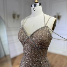 a dress on display in a room with white walls